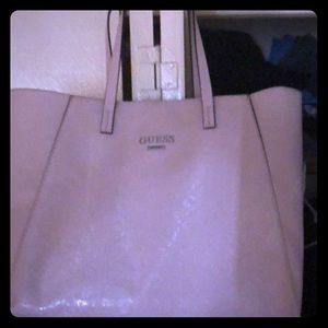 Baby pink oversized guess bag.